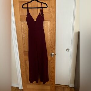 Burgundy romper size small with lace back zipper up wide leg style